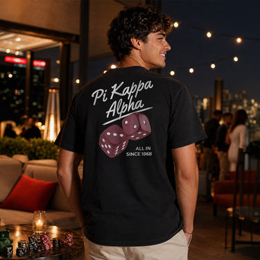 Model wearing the High Roller Tee from the back, featuring a full back dice graphic on a black Comfort Colors tee.
