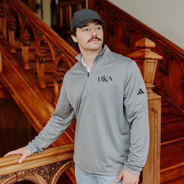 Pi Kappa AlphaFraternity Grey Adidas Lightweight Performance 1/4 Zip with Greek letters.
