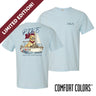 Light blue Comfort Colors t-shirt shown front and back; front features small Greek letters on the left chest, back displays a golden retriever sailing a boat with script text above and “Chasing Open Water” below.