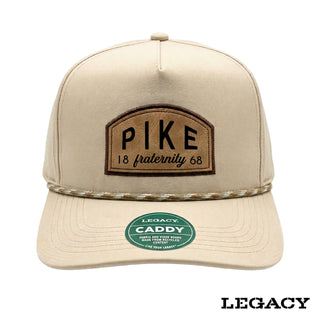 Cream Legacy brand rope hat featuring a brown fraternity patch, designed for stylish fraternity apparel and casual campus wear.